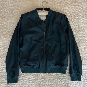 SLEEK HEI HEI BOMBER JACKET IN EMERALD GREEN.